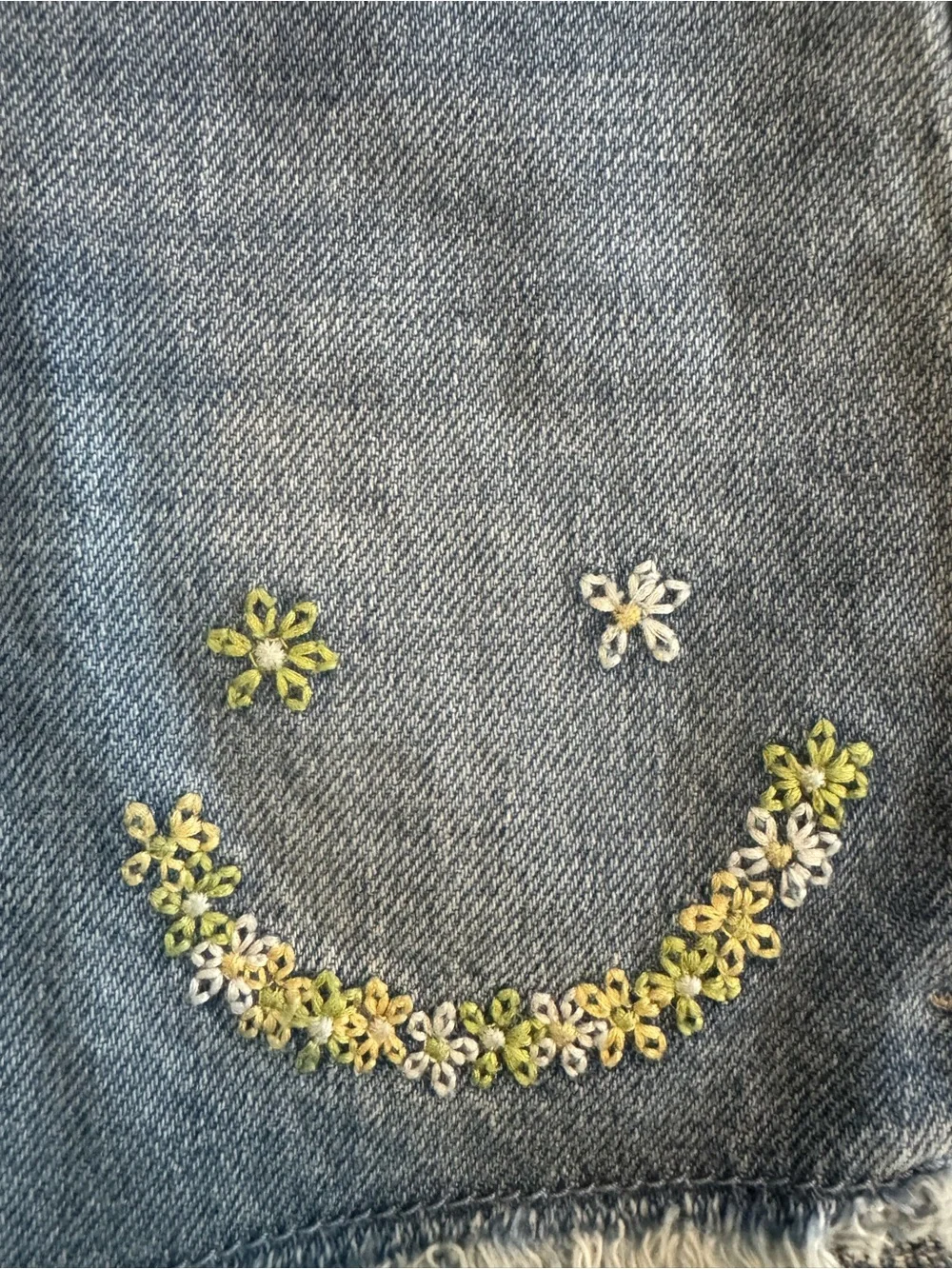 Old Navy Blue Denim Cutoff Shorts with Embroidered Smile and Daisies